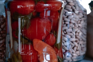 A close-up view of hand-crafted jars filled with rich, flavorful sauces.