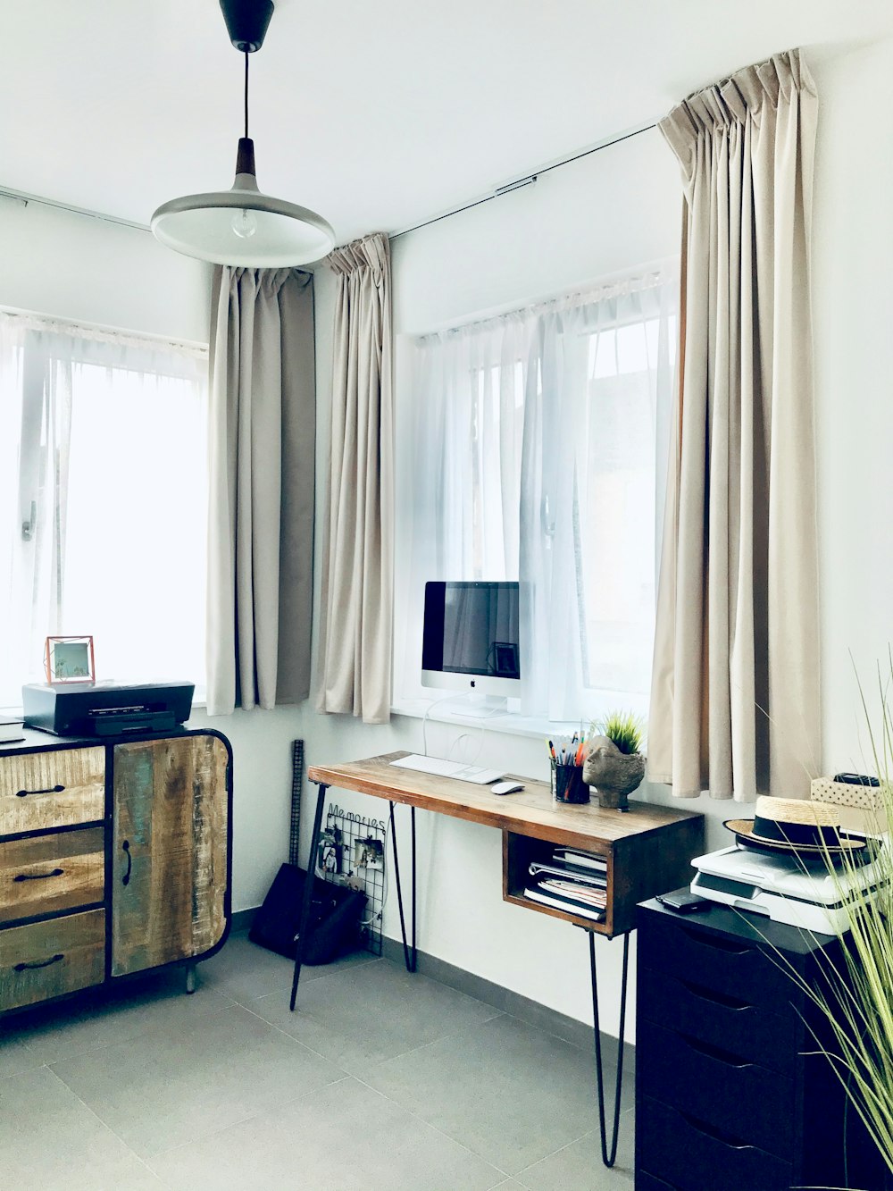 white and brown wooden desk with computer set