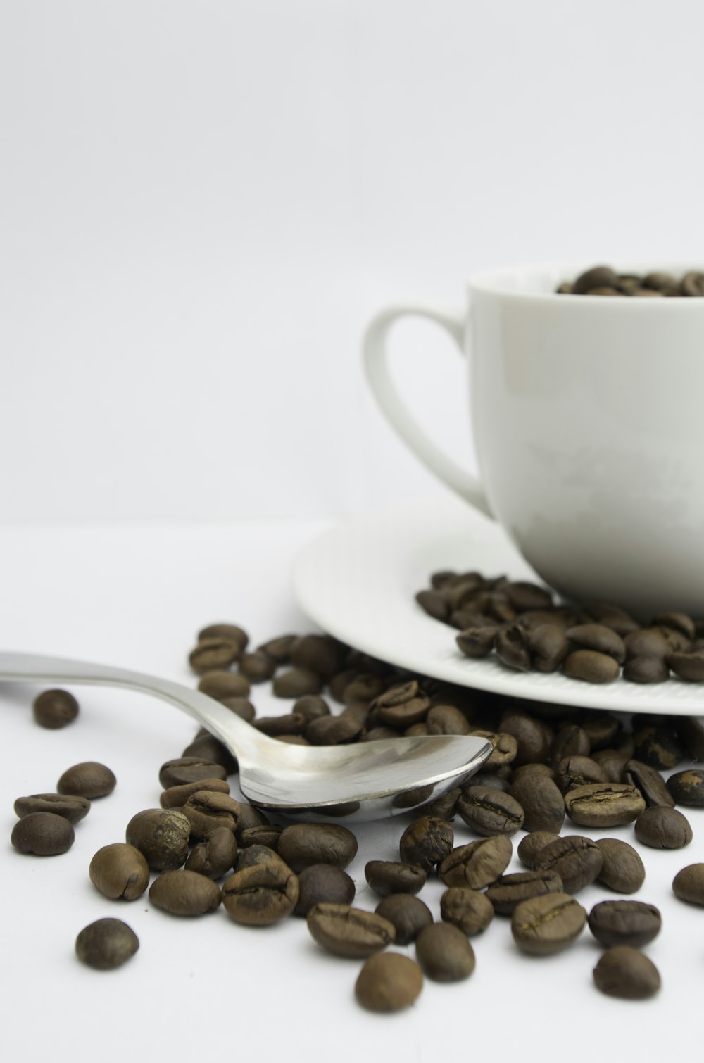 white ceramic teacup on saucer