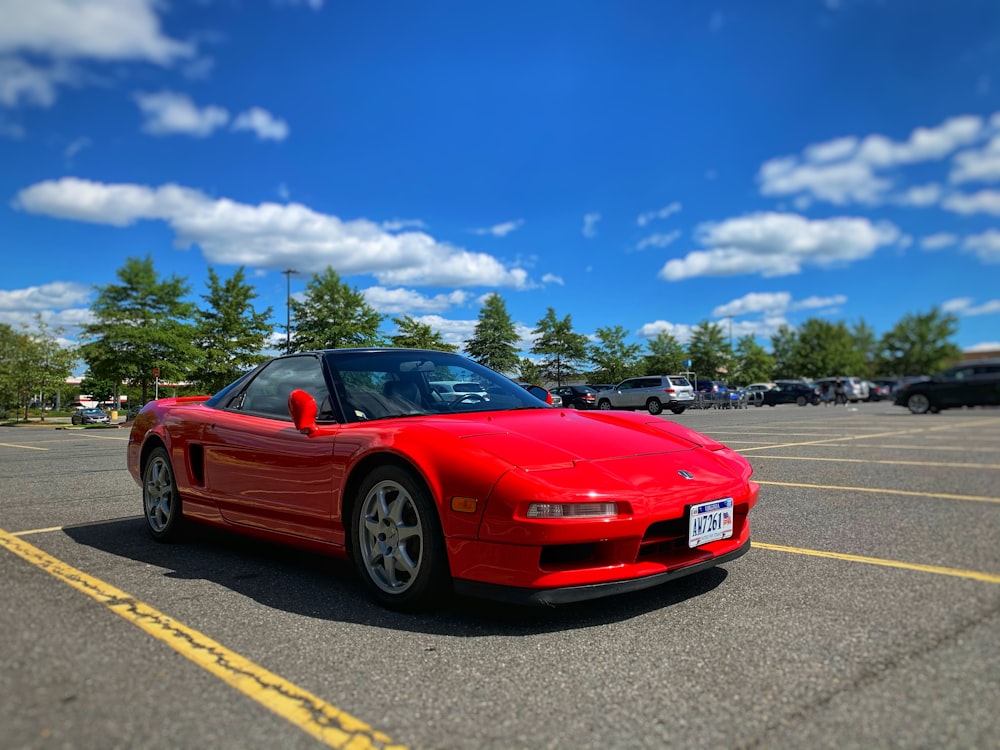 red ferrari sports car on road during daytime