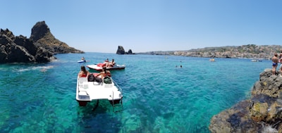 A group of people enjoying water sports, showcasing fun and excitement in a beautiful coastal setting.