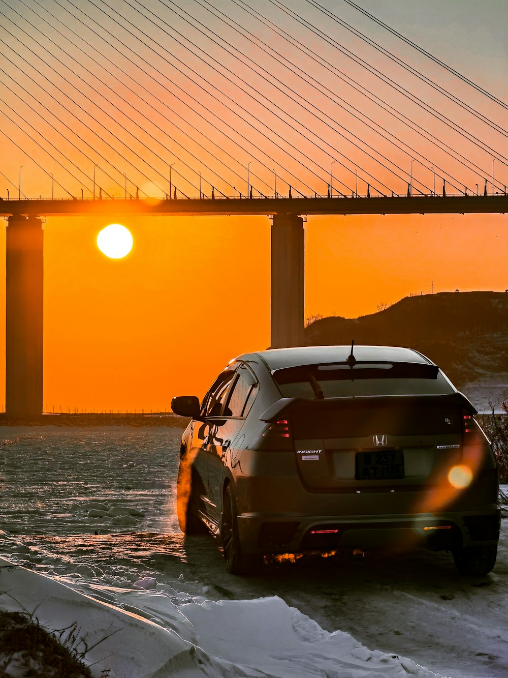 silver bmw m 3 parked on beach shore during sunset