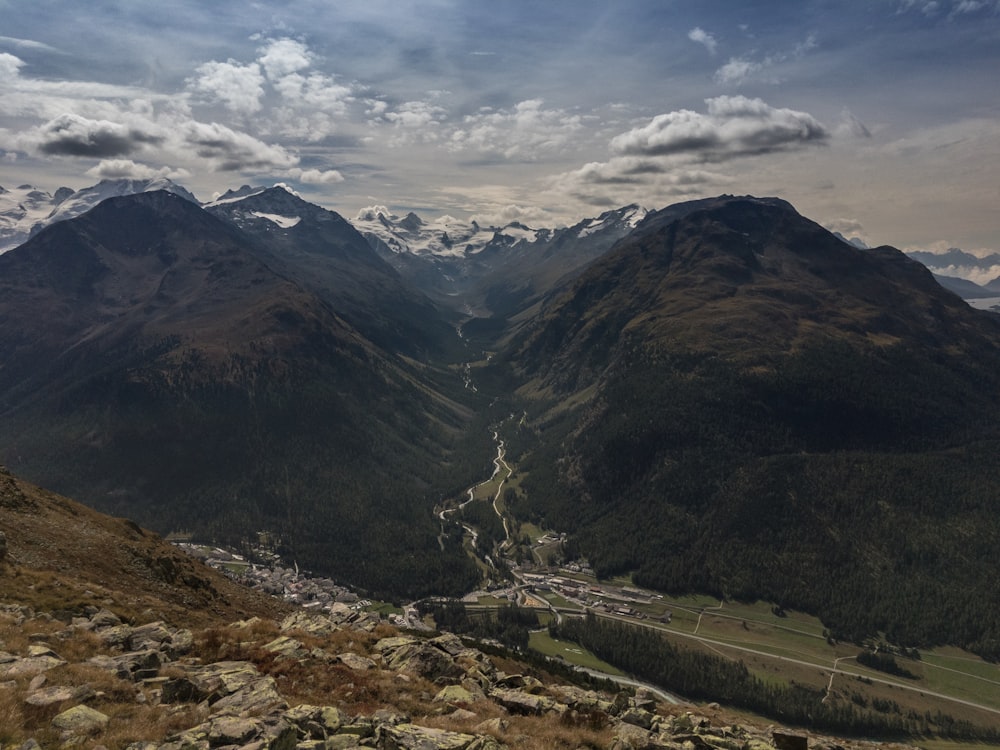 green mountains under white clouds during daytime