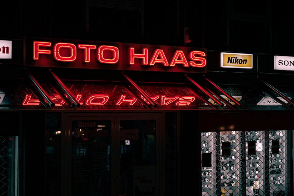 a red neon sign that reads foto haas