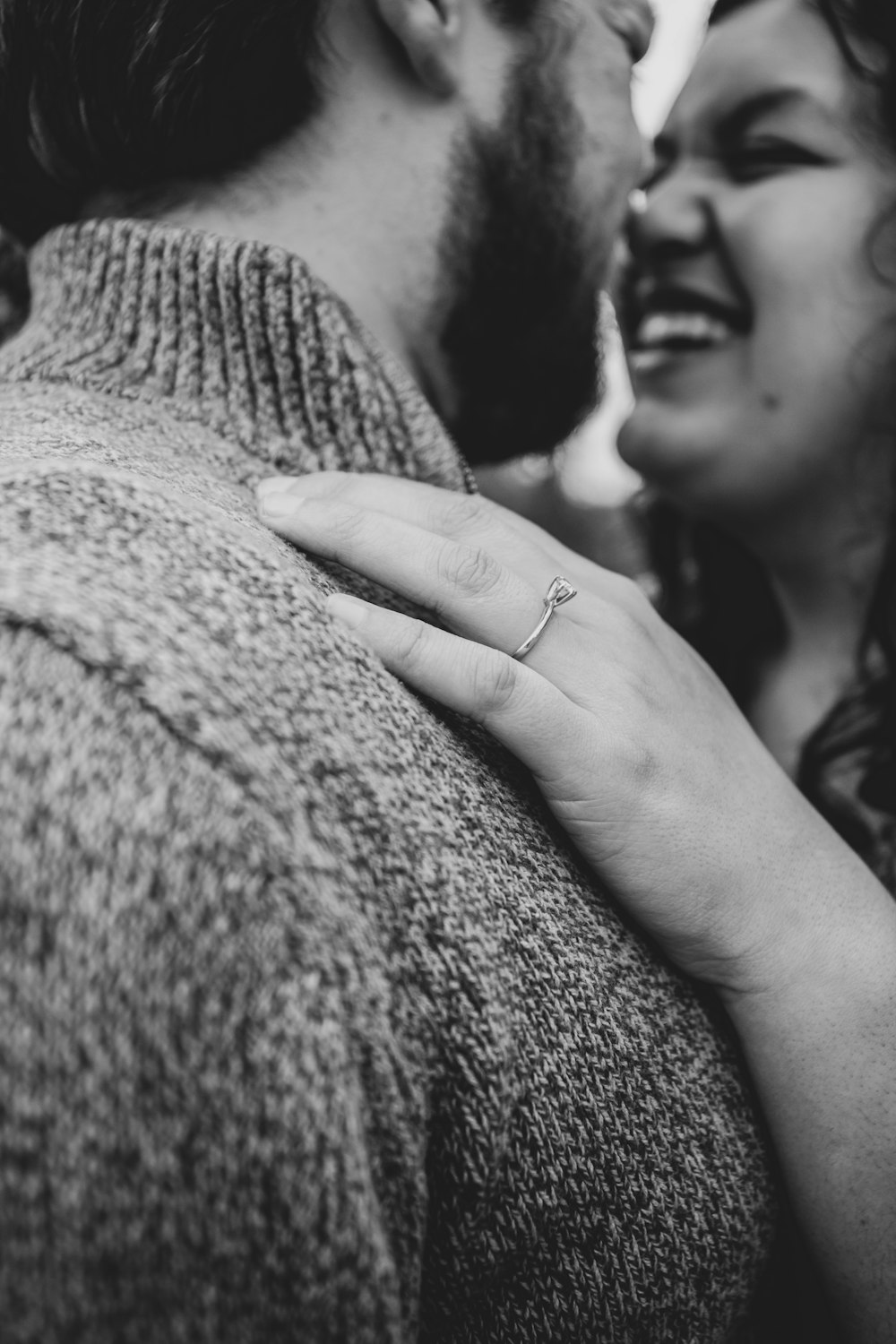 grayscale photo of woman holding mans hand