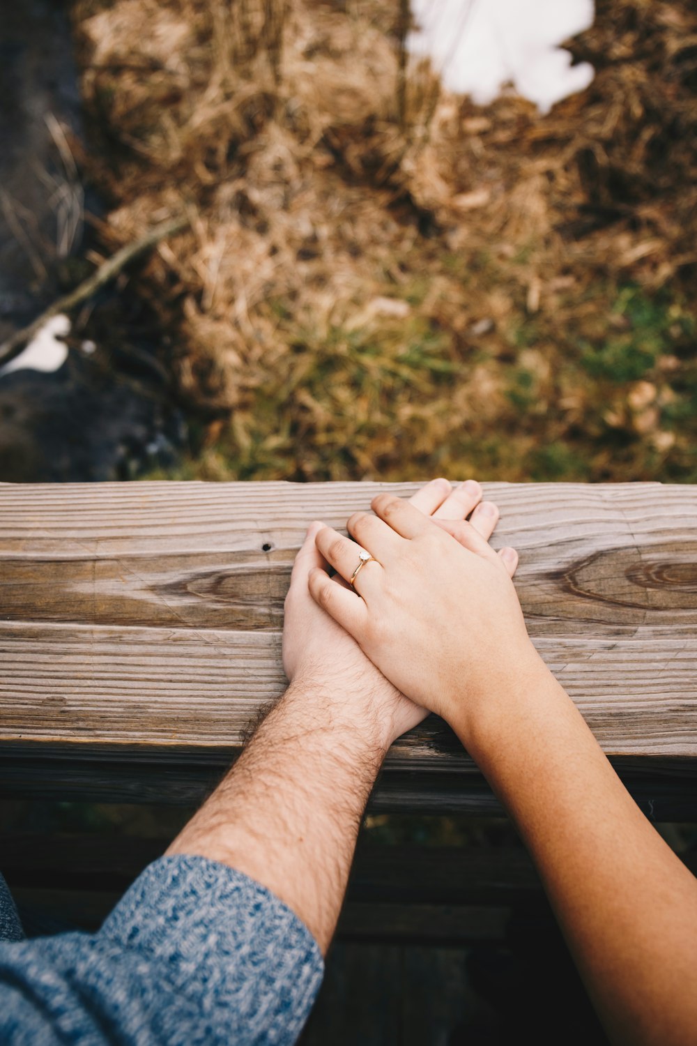 persons feet on brown wooden table