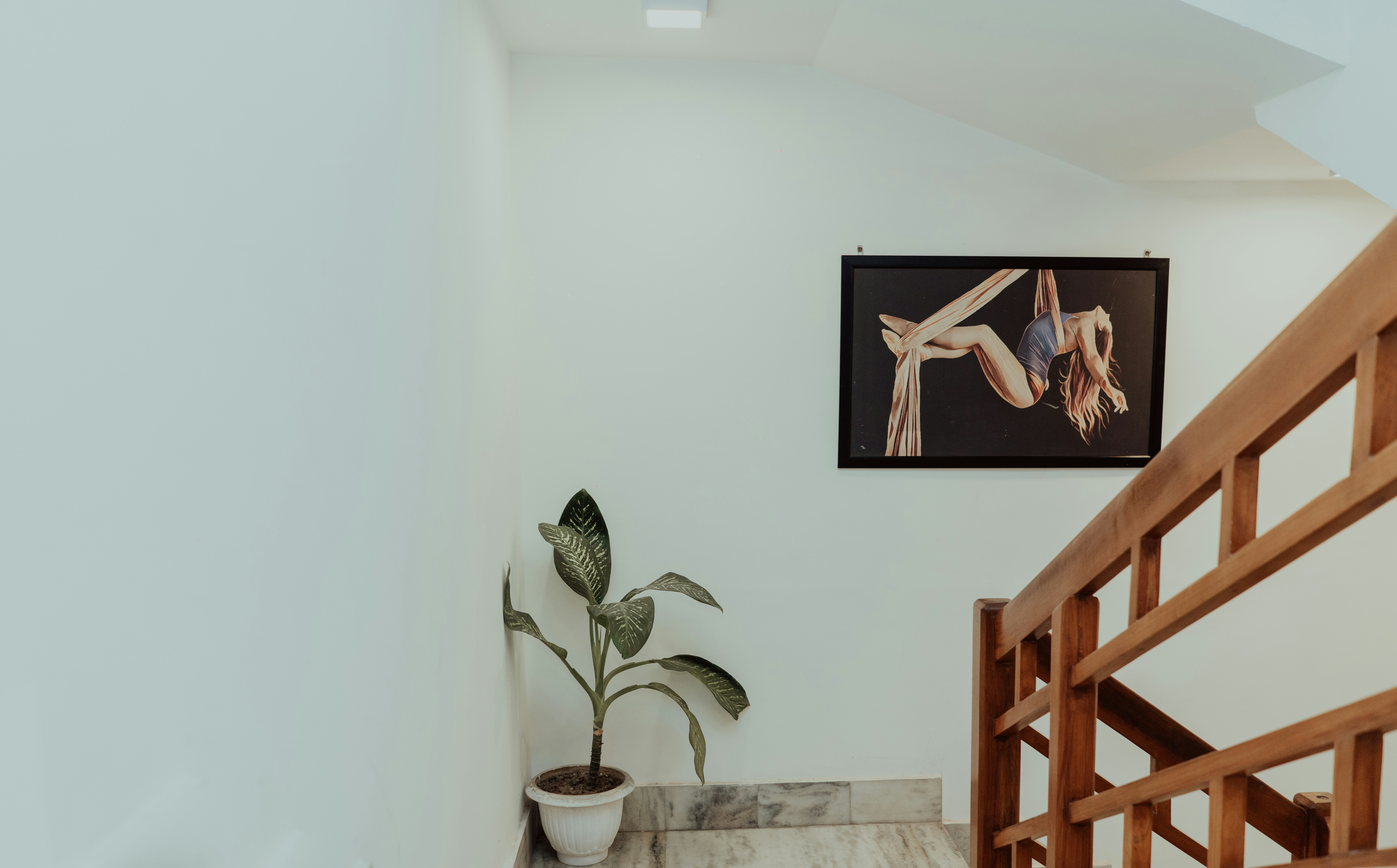 black flat screen tv turned on showing man in black suit jacket