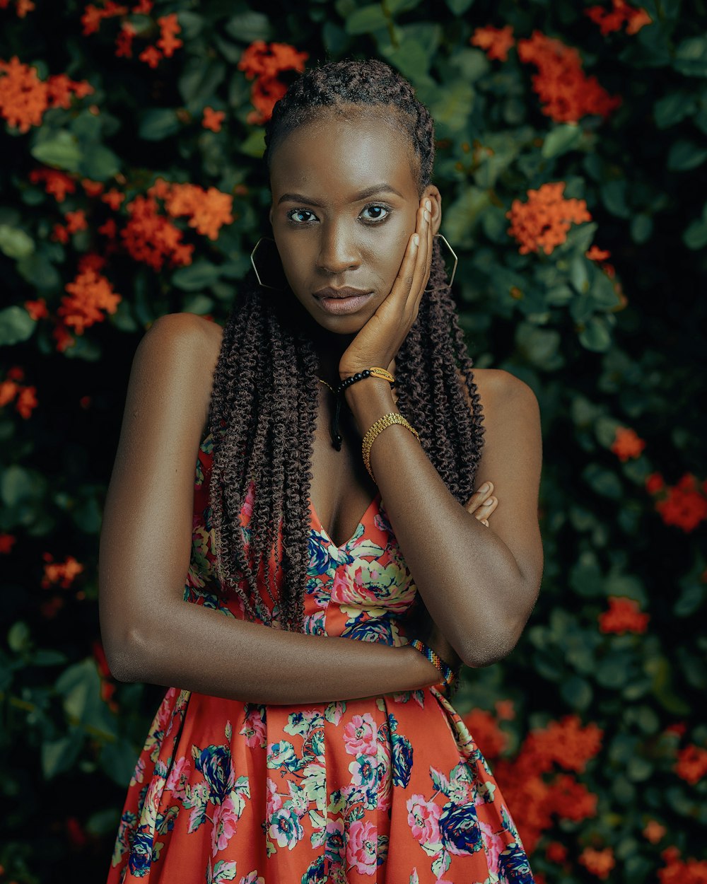 woman in red and white floral sleeveless dress