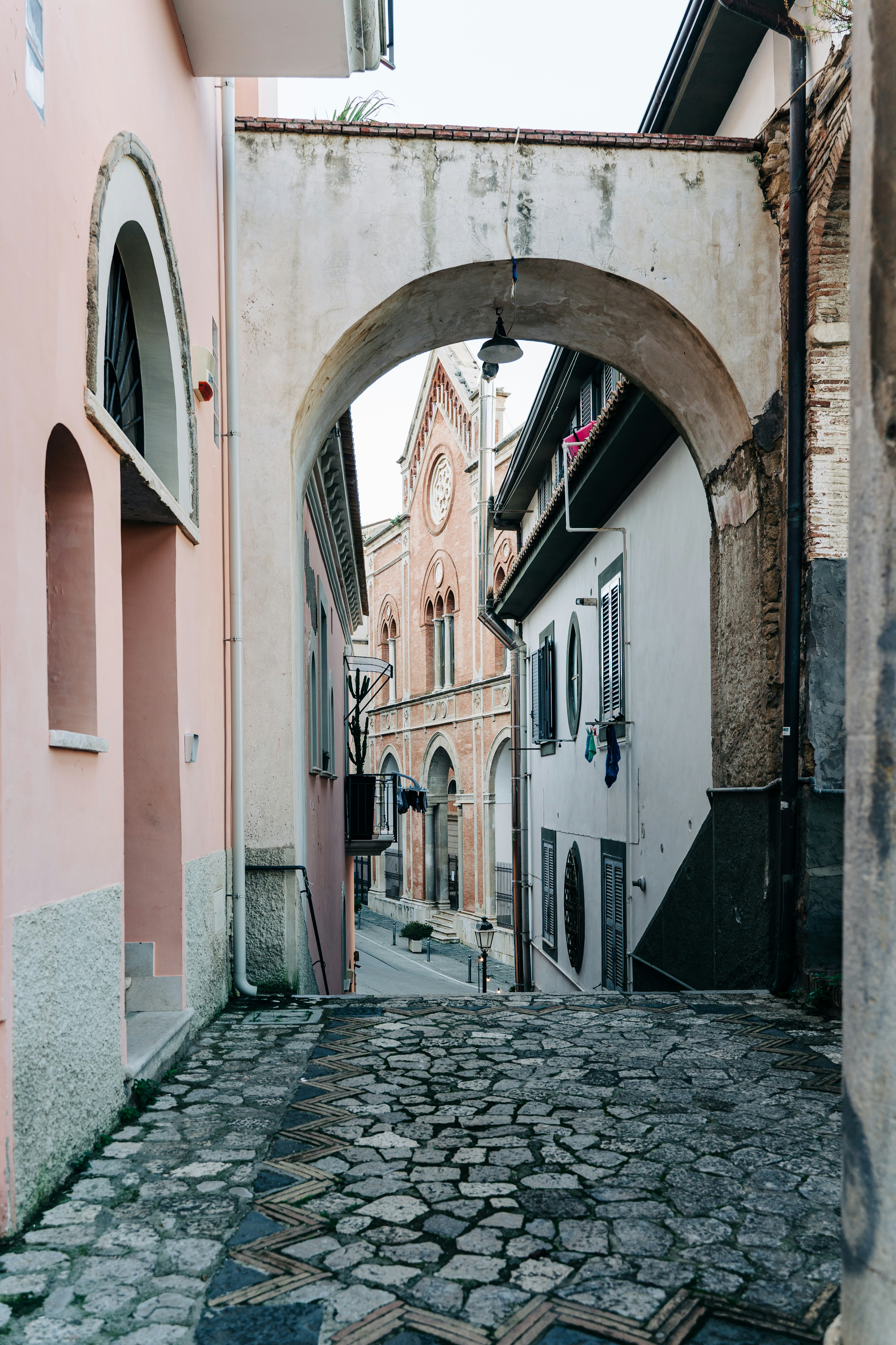 Pink and sandstone hues in the old town of Gaeta, Italy