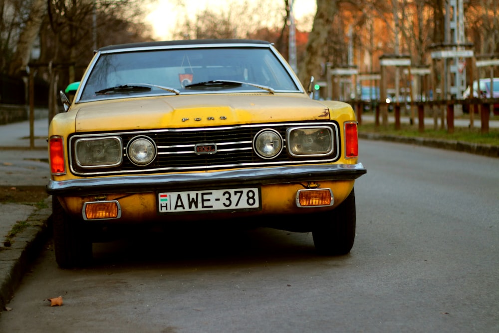 yellow chevrolet camaro on road during daytime