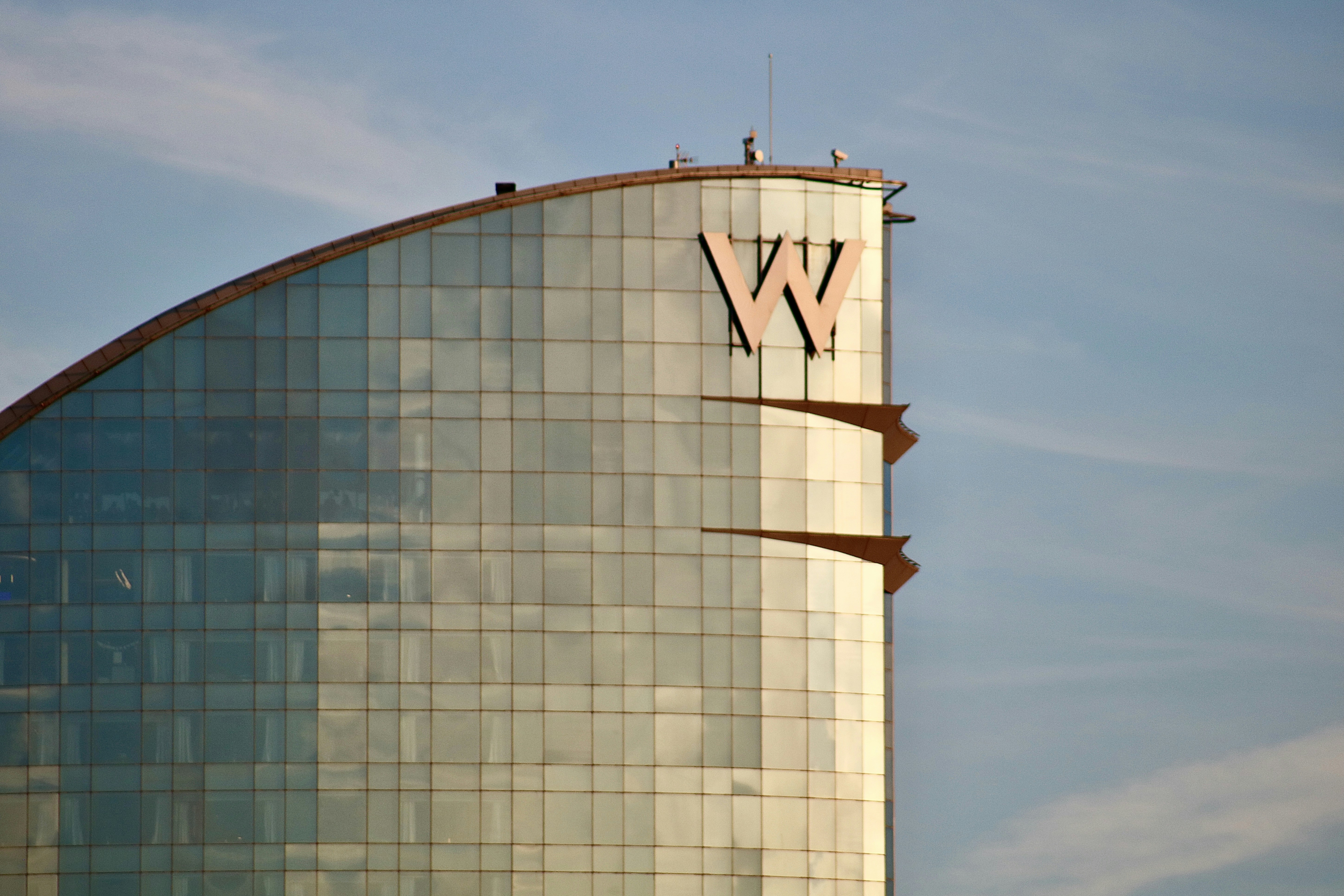 white and blue concrete building under blue sky during daytime, 