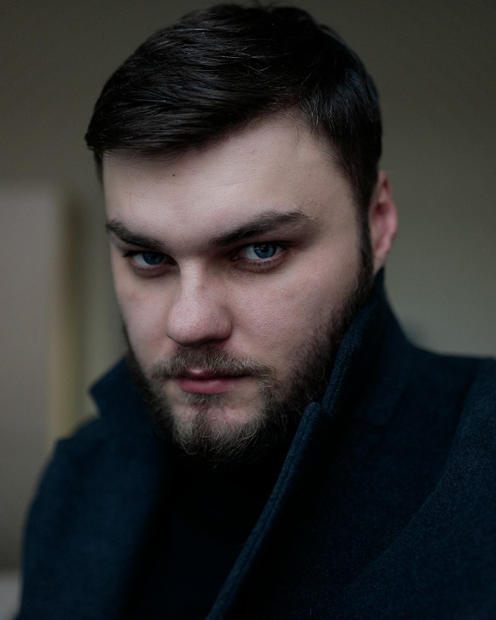 man in blue hoodie standing