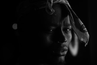 womans face in grayscale photography
