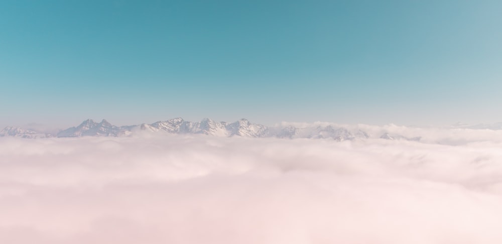 snow covered mountain under blue sky during daytime