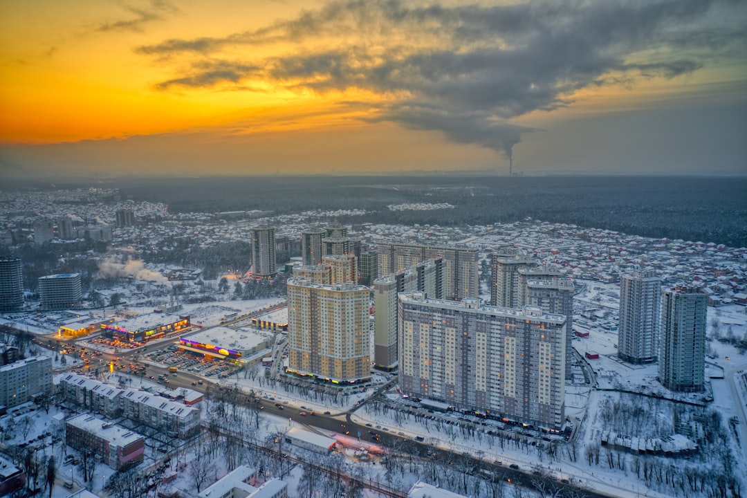 city skyline under cloudy sky during daytime