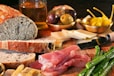 sliced meat on brown wooden chopping board