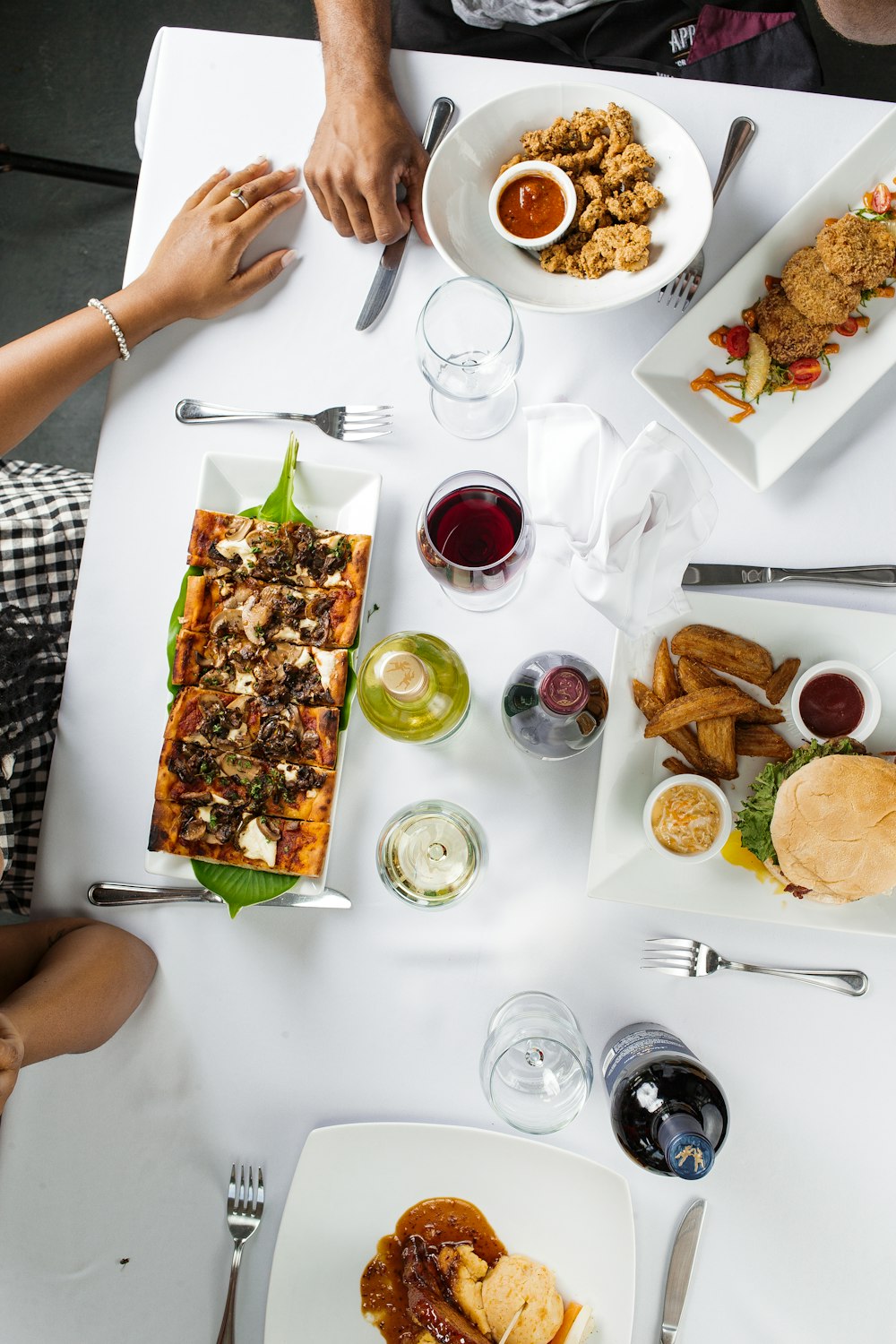 person holding white ceramic plate with food