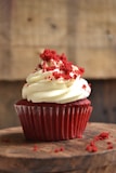 white and red cupcake with white icing on top