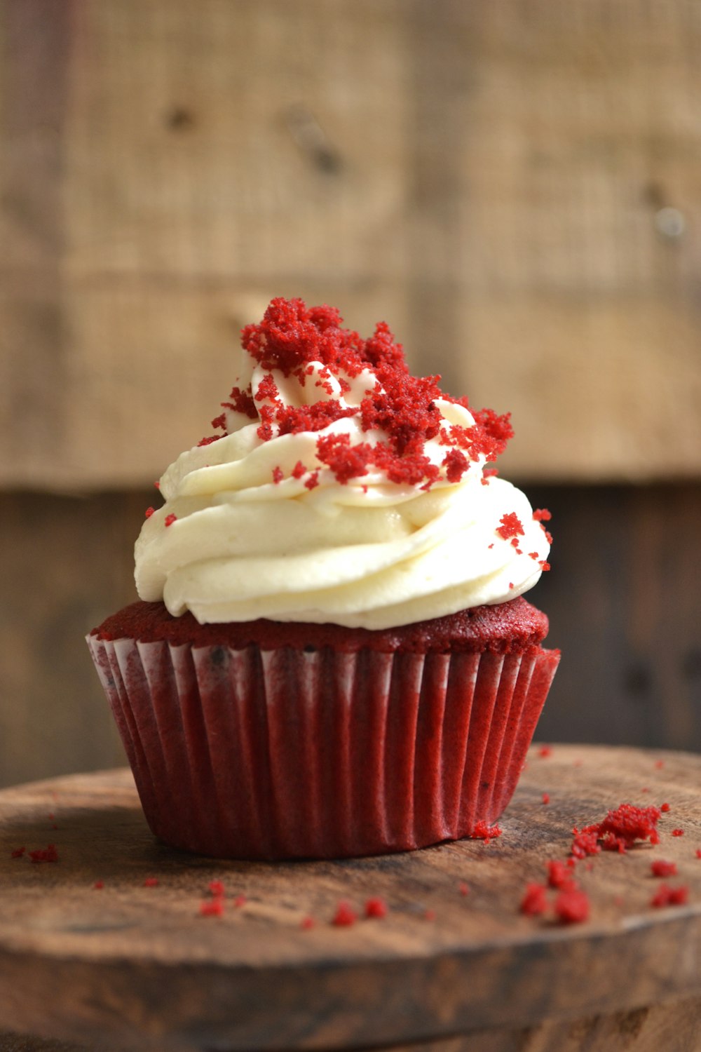 white and red cupcake with white icing on top