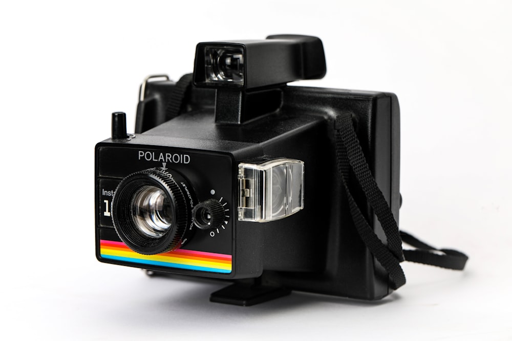 black and silver polaroid camera