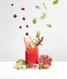 strawberry juice in clear drinking glass