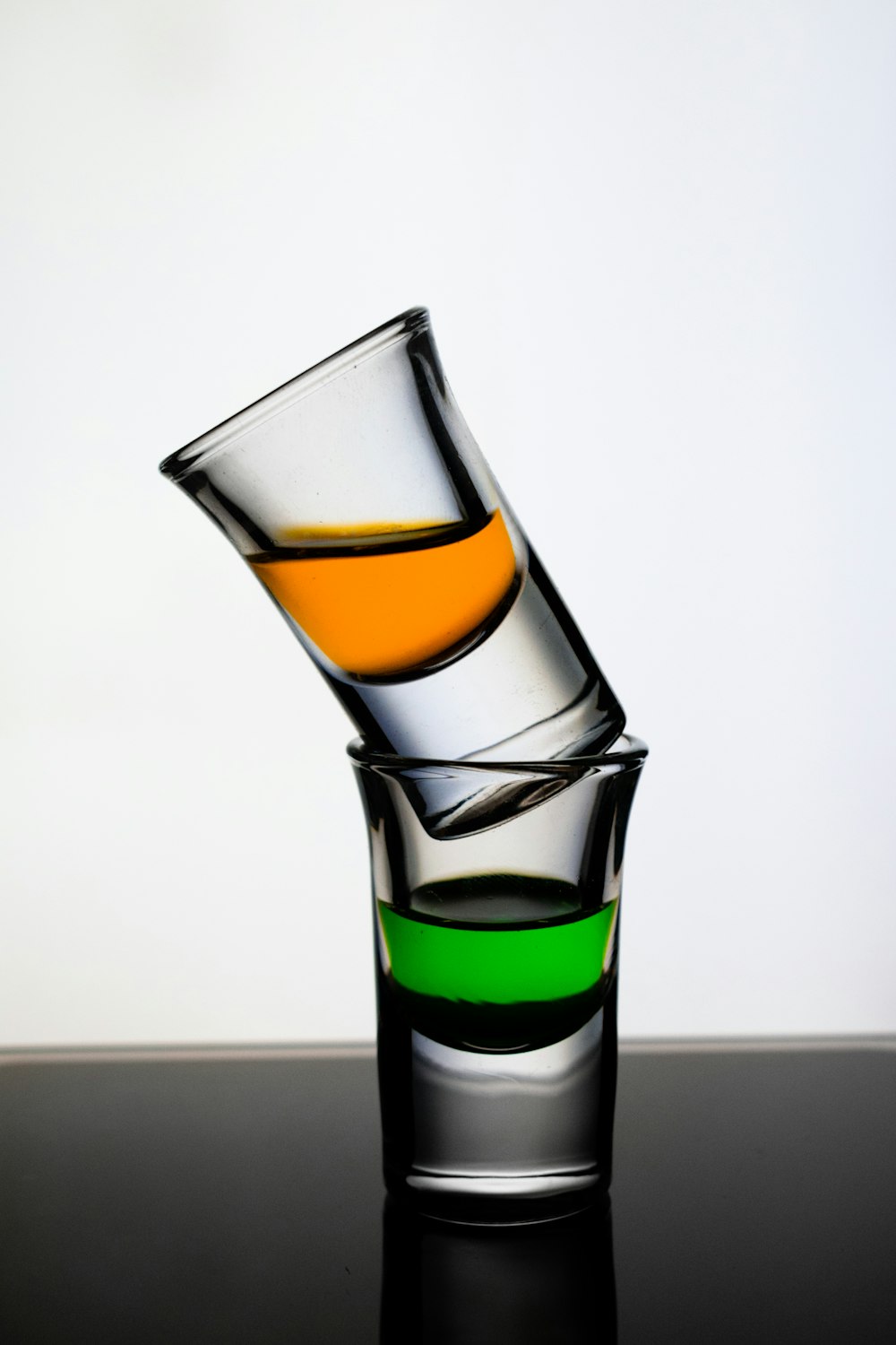 clear drinking glass with orange liquid
