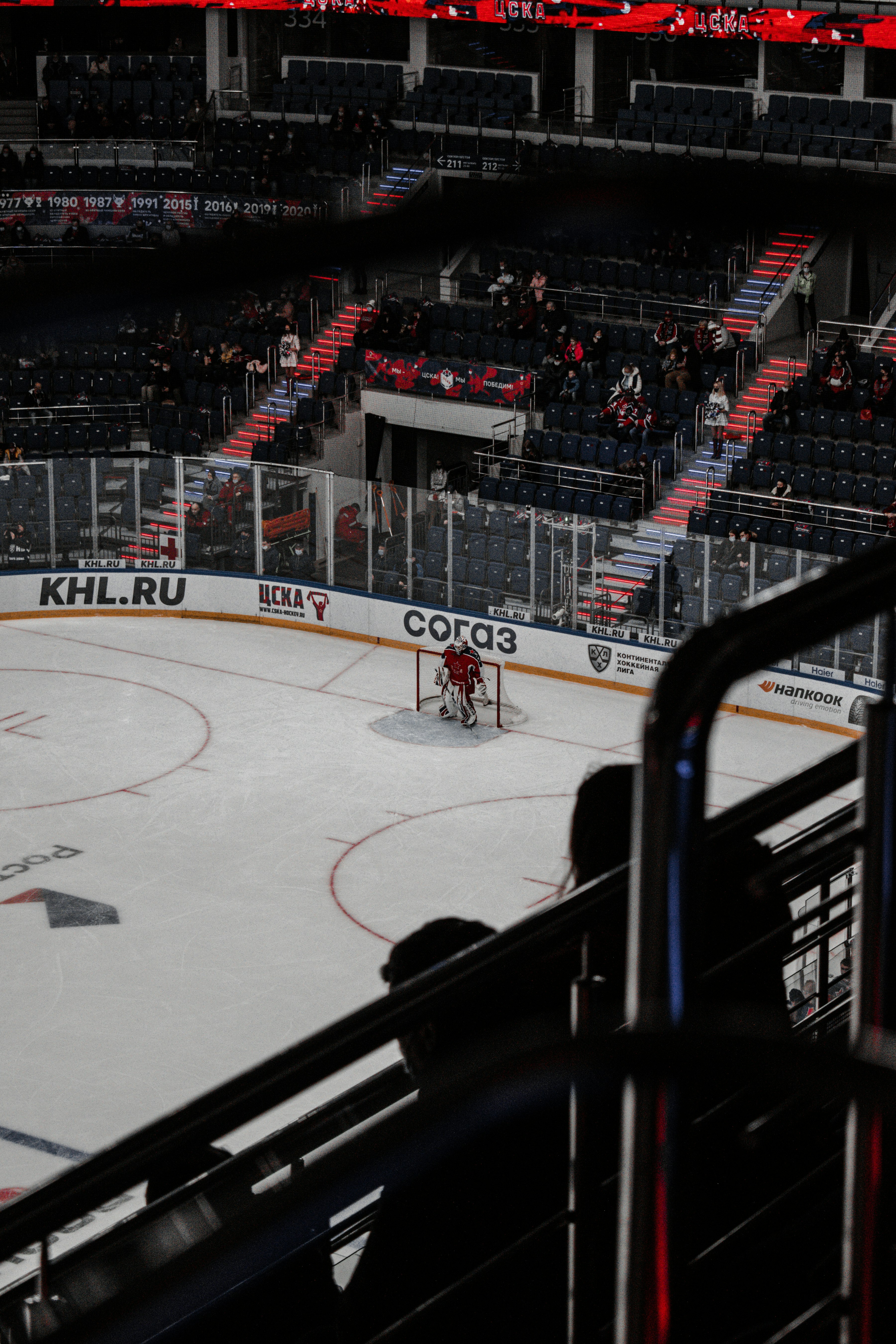 people playing ice hockey inside stadium