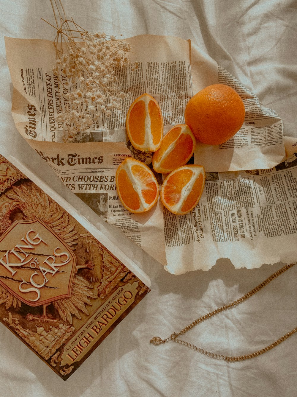 orange fruit on white textile