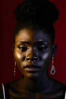 woman in gold earrings and silver earrings