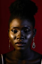 woman in gold earrings and silver earrings