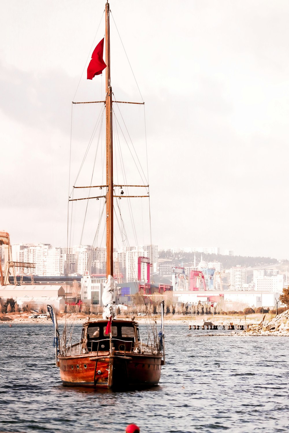 black and red boat on sea during daytime