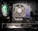 A computer interior showcasing key components such as a cooling fan with RGB lighting, a large central fan branded with 'AMD', multiple RAM sticks, and a visible graphics card labeled 'GEFORCE RTX'. Several cables are neatly arranged, and the motherboard is slightly visible.