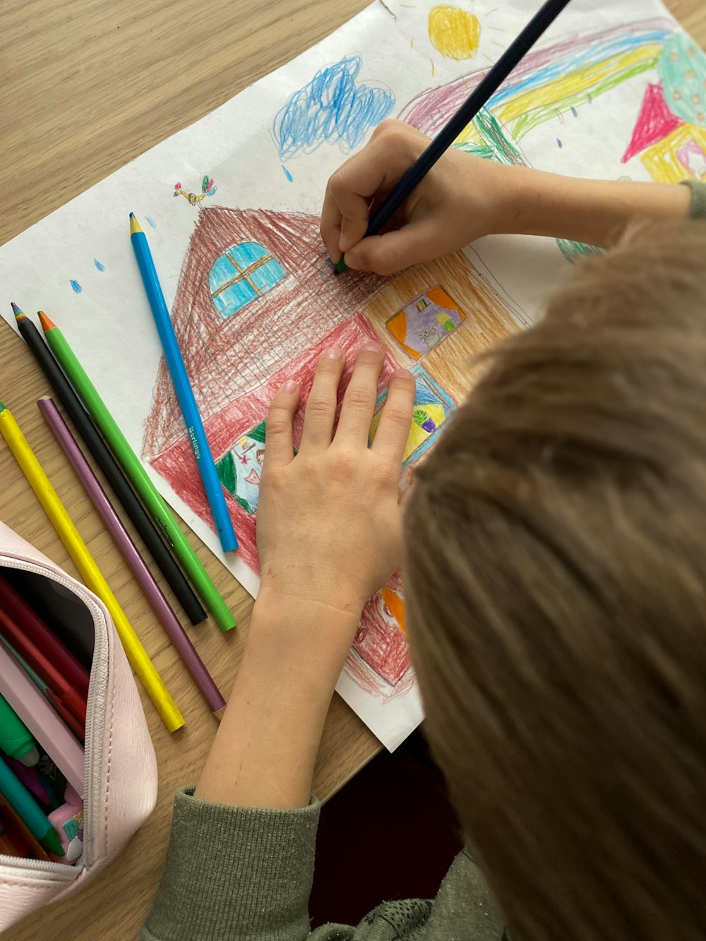 girl drawing on white paper