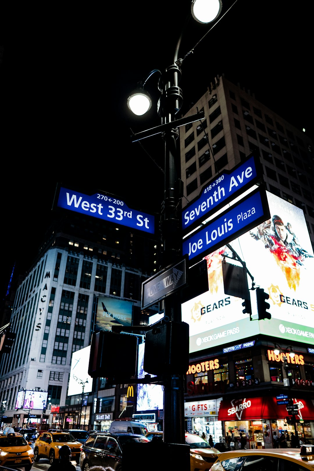 blue and black street sign