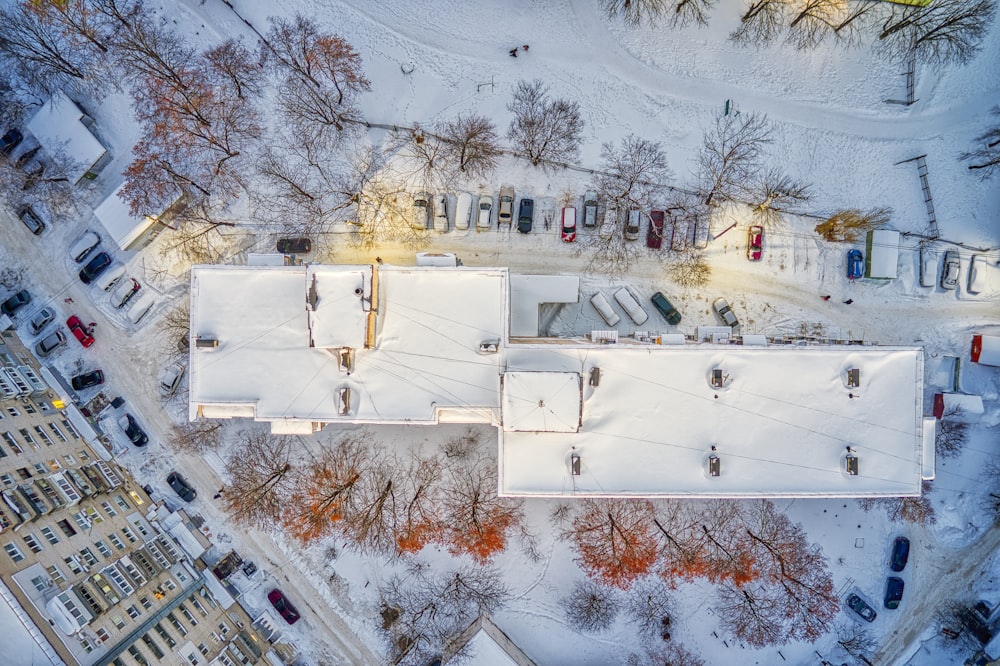 white concrete building with snow on roof