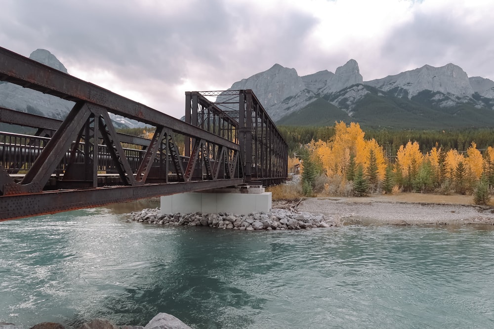 brown wooden bridge over river