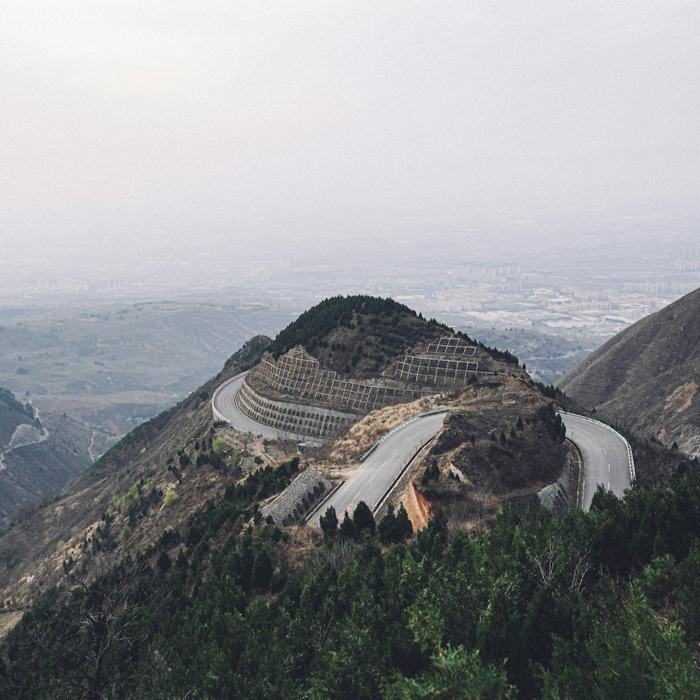 brown and white house on top of mountain