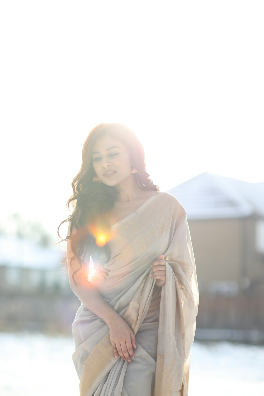 woman in white long sleeve shirt standing during daytime