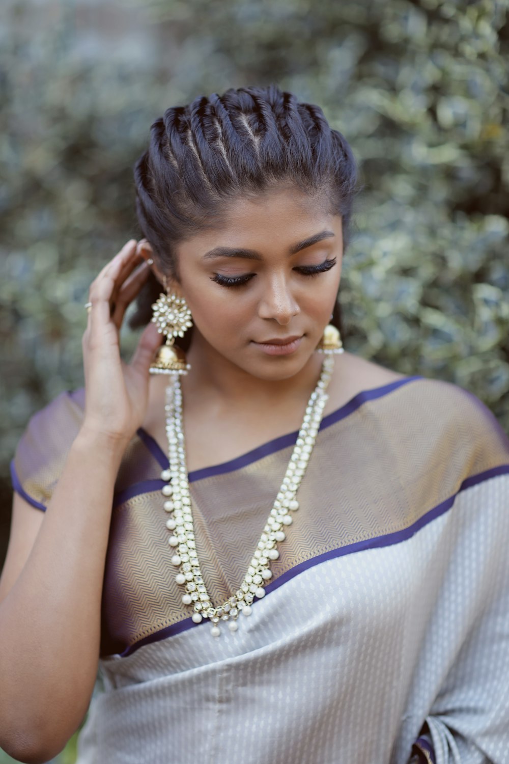 woman in white and blue sleeveless dress