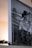 A framed black and white photograph features a couple in wedding attire, embracing closely. The image is partially visible with a focus on the side, which displays the names Mr. & Mrs. Hurtado. Lavender sprigs are placed in the foreground.