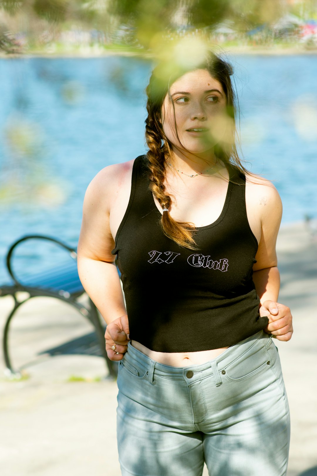 woman in black tank top and blue denim shorts