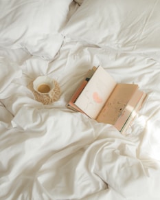 white and gold box on white textile