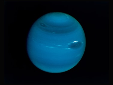 Neptune on a black background