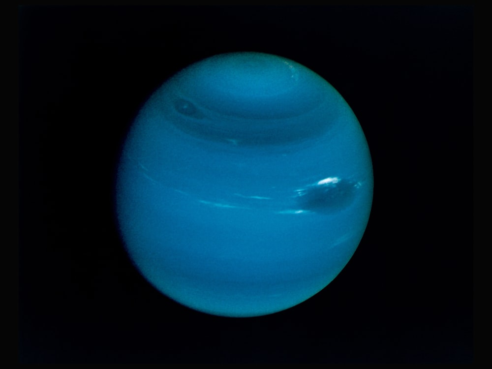 Neptune on a black background