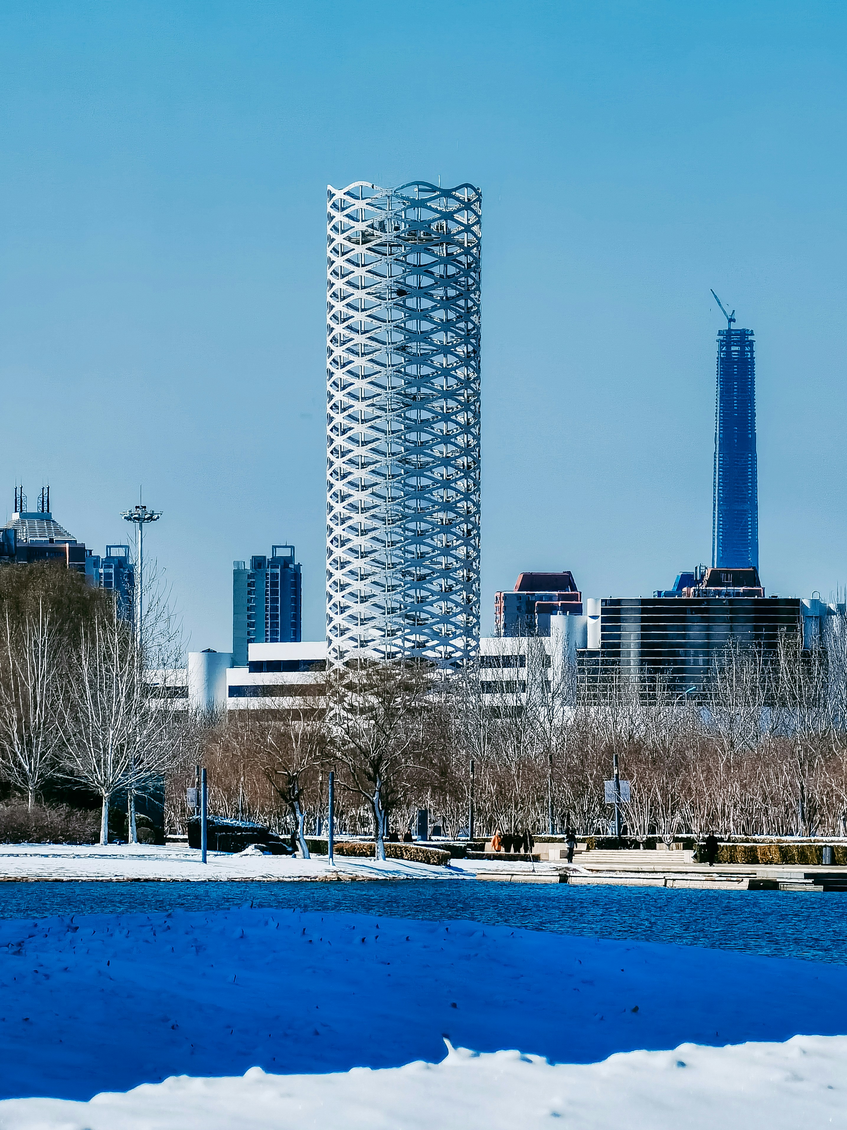 white concrete building near body of water during daytime