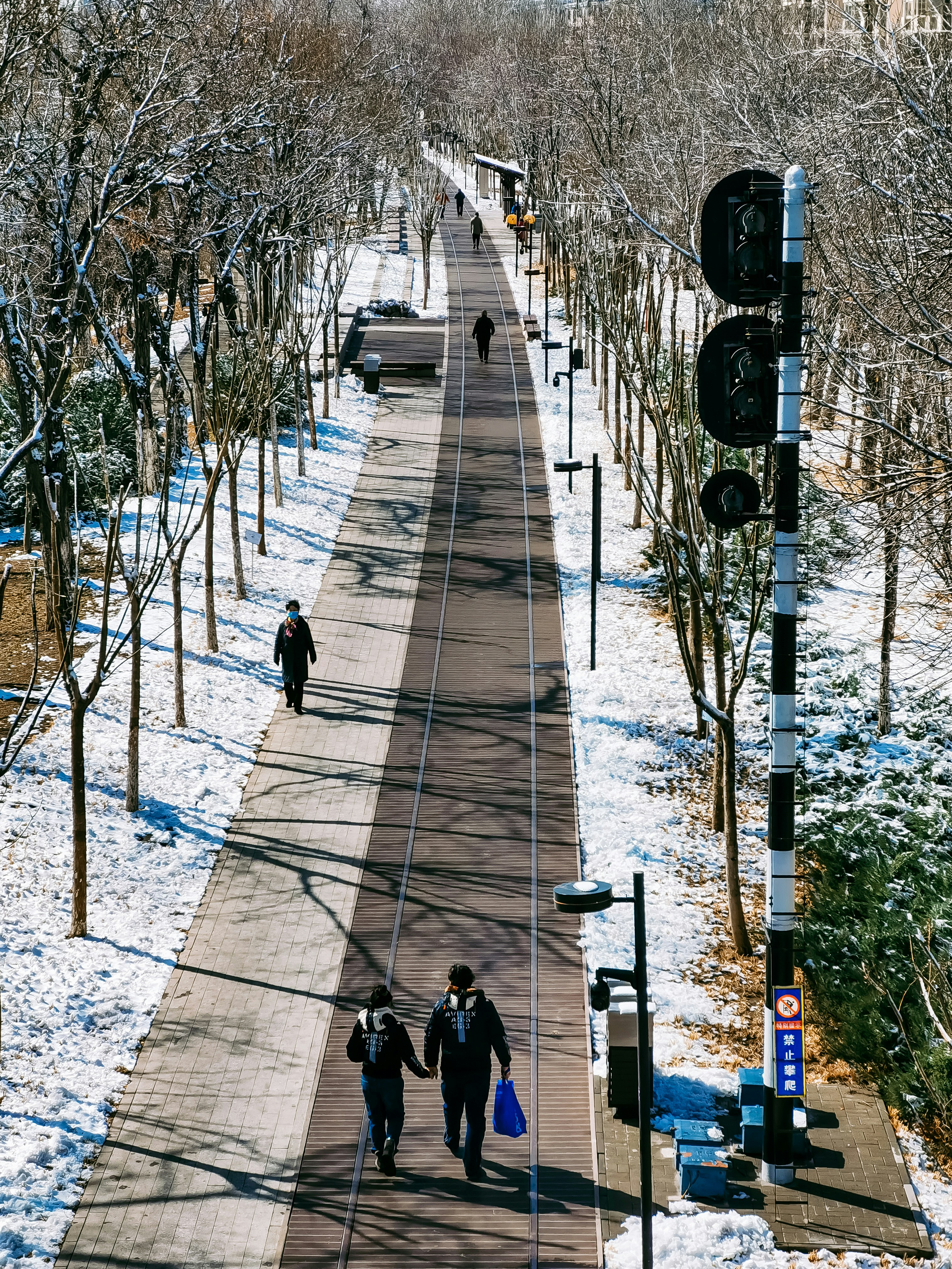 people walking on sidewalk during daytime