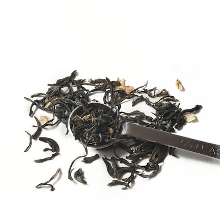 Close-up of vibrant loose leaf tea blend with bright petals and herbs.