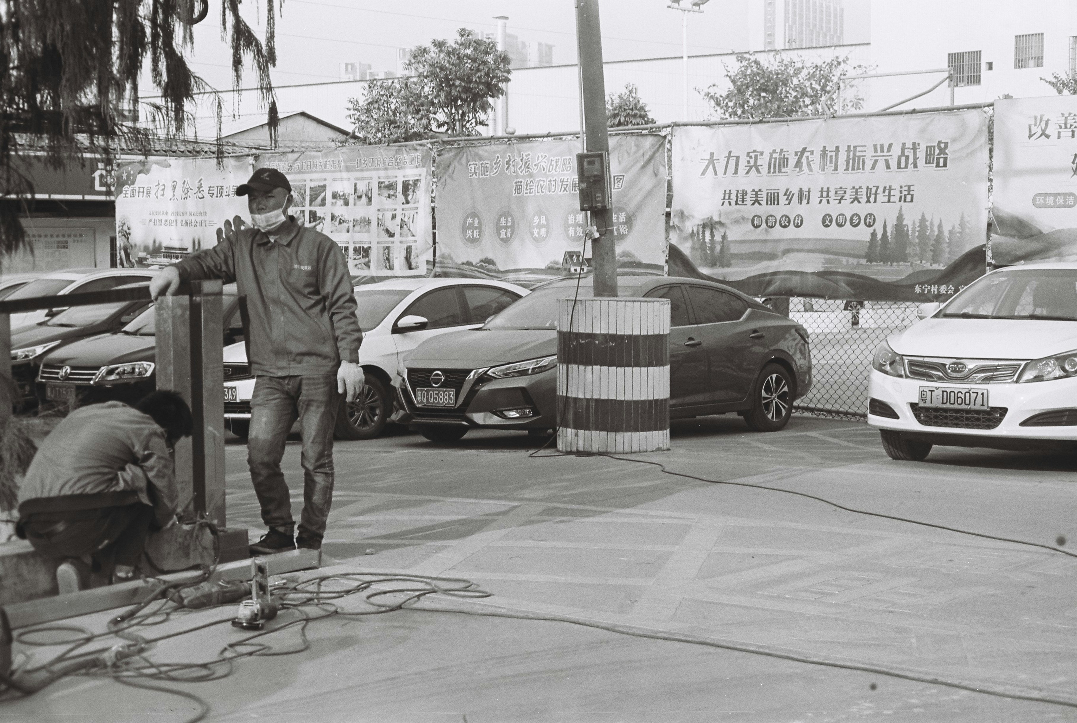 friendly, uniformed electrician standing by a service vehicle - electrical repair ave maria fl