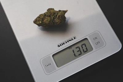 A digital kitchen scale displaying precise measurements next to baking ingredients.