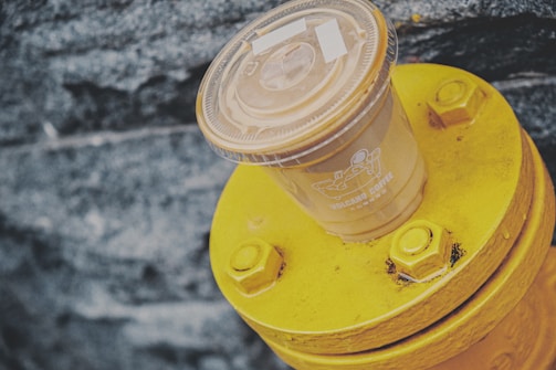 A colorful banner and hat design for a local coffee shop, showcasing volcan media's creative touch.